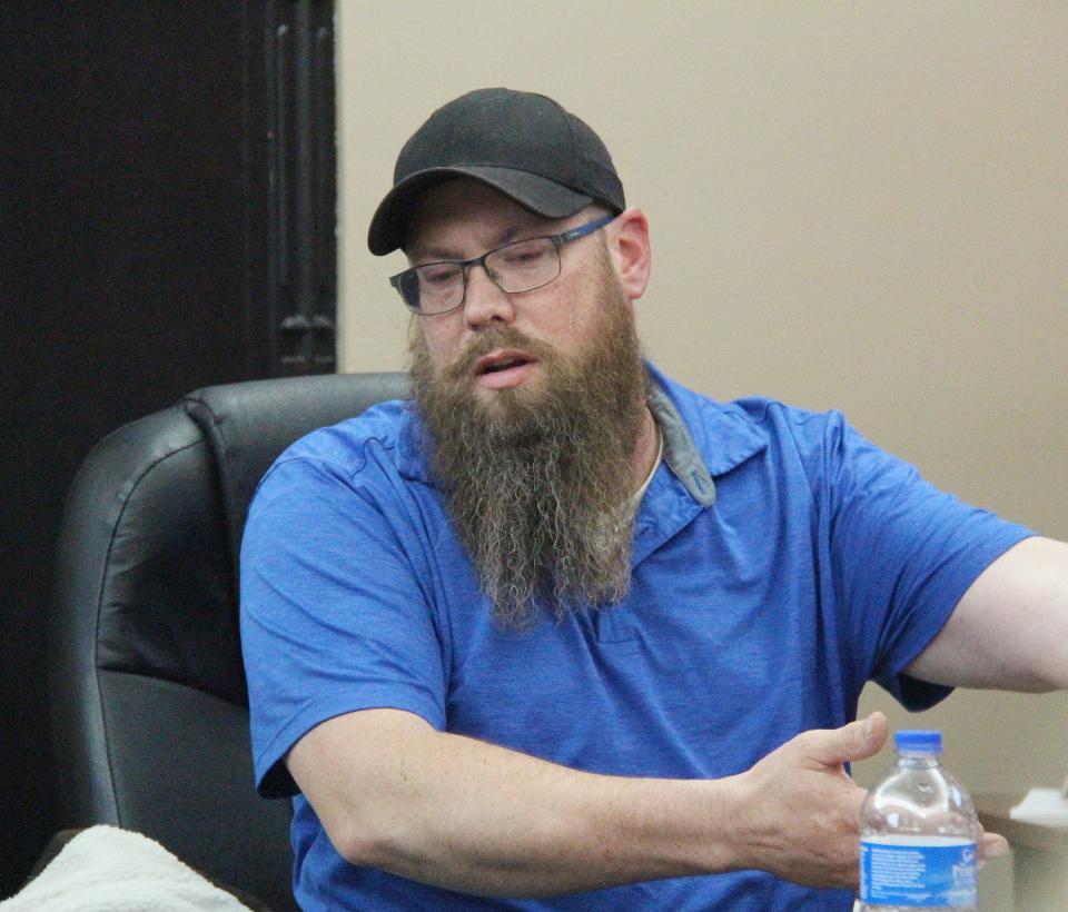 Commissioner Chad Daiker explains drainage during the Chenoa City Council meeting Tuesday.