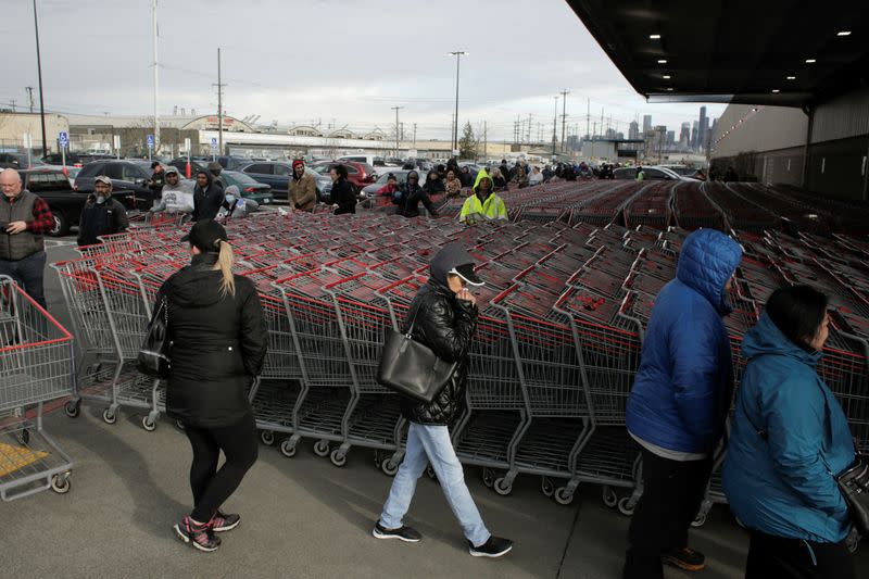 Shoppers line up at a Costco store, following reports of coronavirus disease (COVID-19) cases in the country, in Seattle