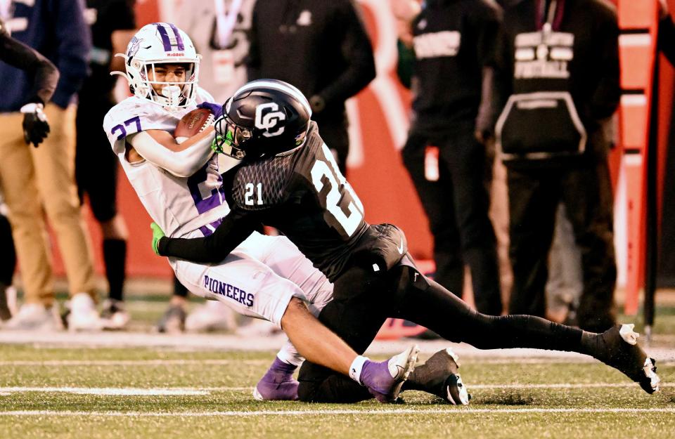 Corner Canyon’s Henry Holliday tackles Lehi’s Kolose Latu as they play in high school football semifinal action at Rice-Eccles Stadium in Salt Lake City on Friday, Nov. 10, 2023. Corner Canyon won 63-24. | Scott G Winterton, Deseret News