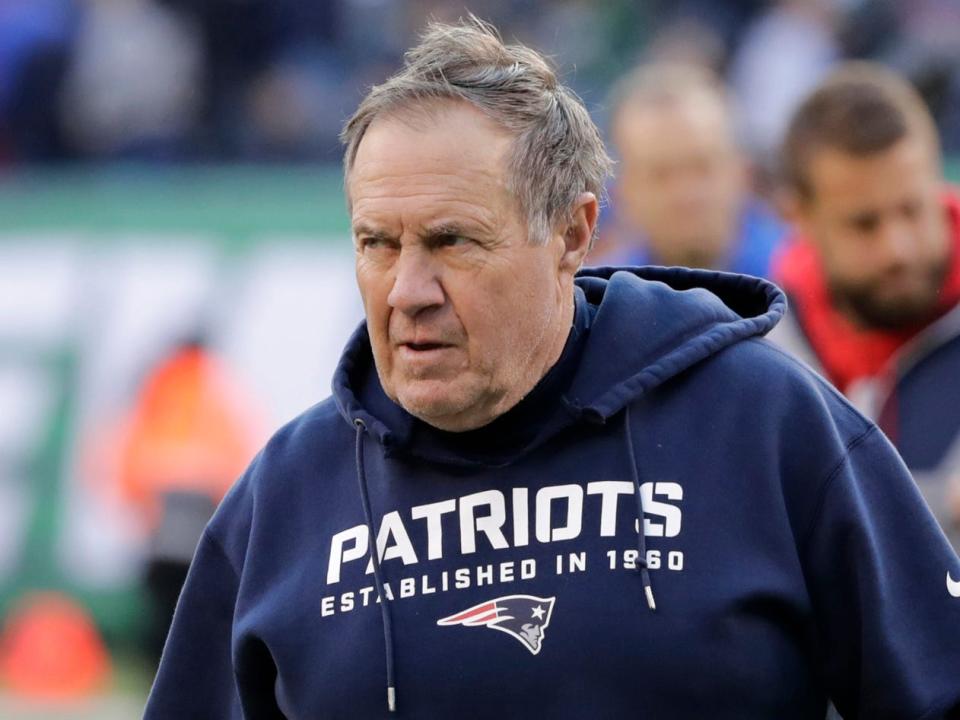 Bill Belichick looks on from the sidelines.