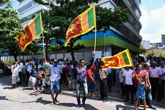 Supporters of Sri Lanka’s new president, Gotabhaya Rajapaksa, celebrate in Colombo on Monday (AFP via Getty)