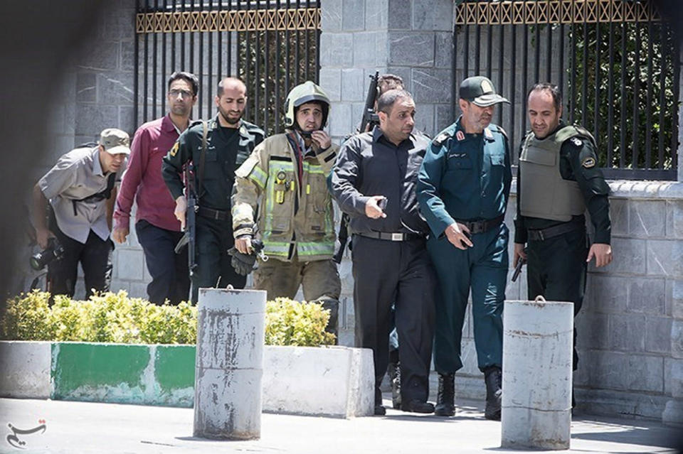 Members of Iranian forces are seen during an attack