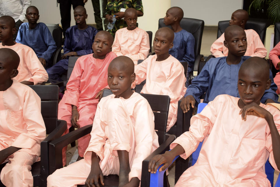 The freed students of the LEA Primary and Secondary School Kuriga upon their arrival at the state government house in Kaduna, Nigeria, Monday, March 25, 2024. More than 130 Nigerian schoolchildren rescued after more than two weeks in captivity have arrived in their home state in northwestern Nigeria ahead of their anticipated reunions with families. (AP Photo/Habila Darofai)