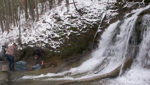 Collecting water runoff in West Virginia.  / Credit: CBS News