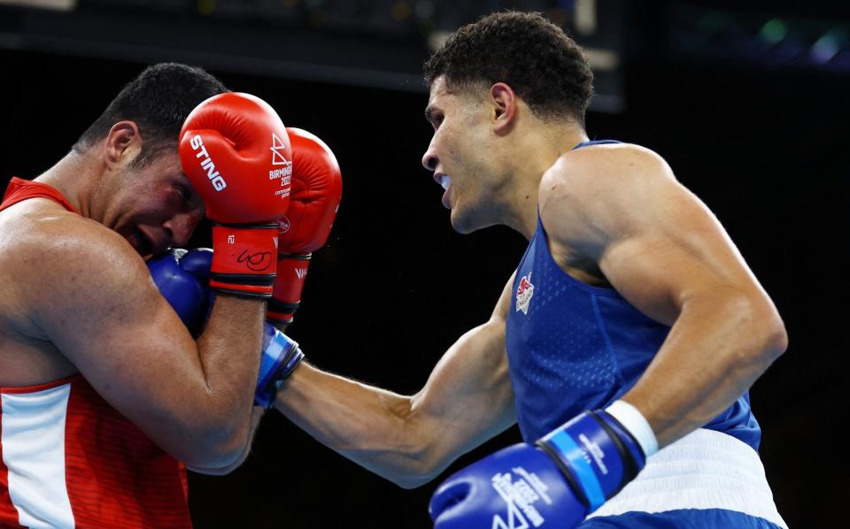 Commonwealth Games - Boxing Menâ€™s Over 92kg (Super Heavyweight) - Gold Medal - The NEC Hall 4, Birmingham, Britain - August 7, 2022 England's Delicious Orie in action against India's Sagar Sager - REUTERS