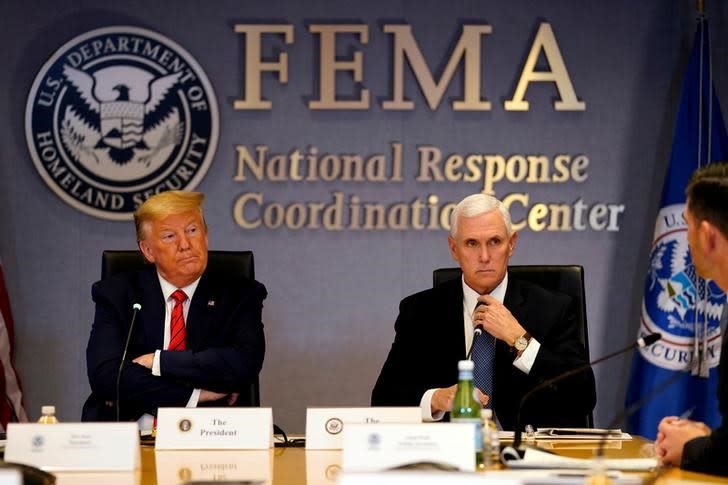 U.S. President Donald Trump and Vice President Mike Pence attend a meeting at the Federal Emergency Management Agency headquarters, in Washington