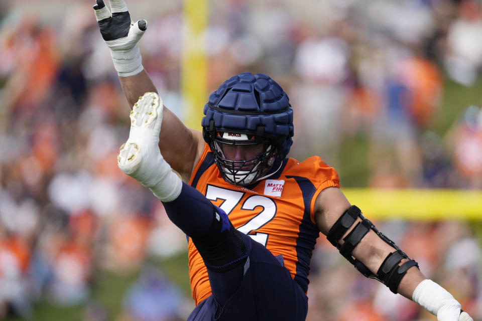 Denver Broncos offensive tackle Garett Bolles stretches during the NFL football team's training camp Friday, July 29, 2022,in Centennial, Colo. (AP Photo/David Zalubowski)