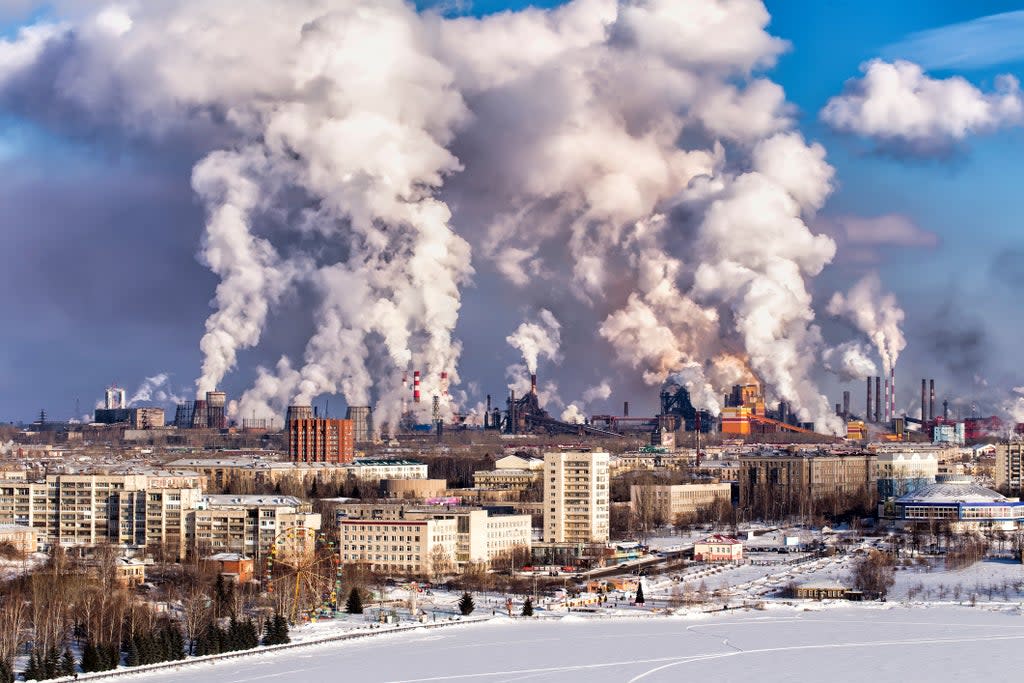 Smoke rises above Chelyabinsk in Russia.  The window of opportunity to cut emissions around the world is ‘rapidly closing’, the UNEP warns (Getty )