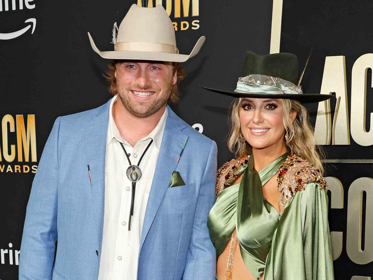 <p>Jason Kempin/Getty</p> Devlin Hodges and Lainey Wilson attend the ACM Awards in May 2023 in Frisco, Texas