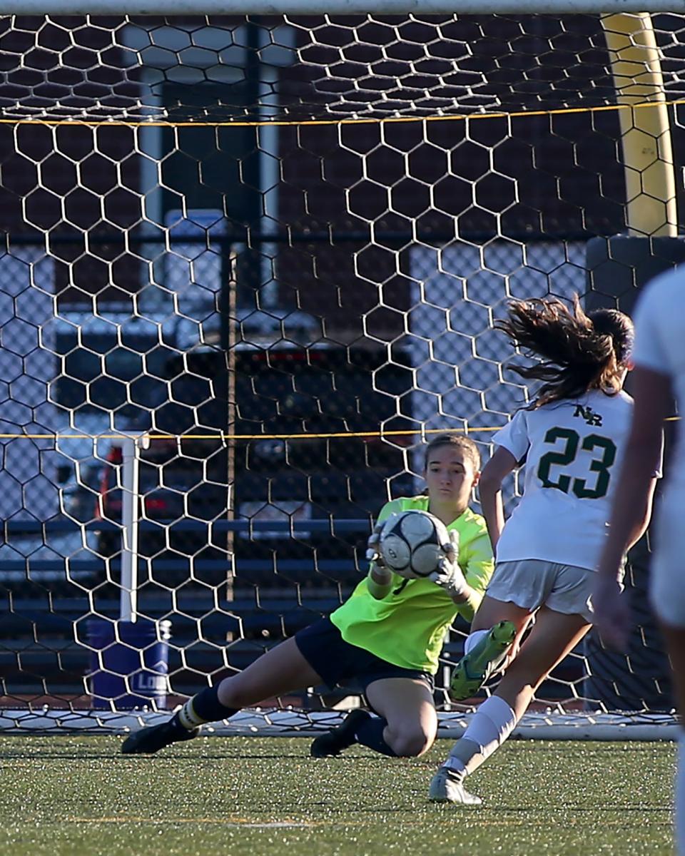 Hanover goalie Mia Pongratz makes a save during first half action of the Division 3 Elite 8 game against North Reading at Hanover High School on Saturday, Nov. 12, 2022.