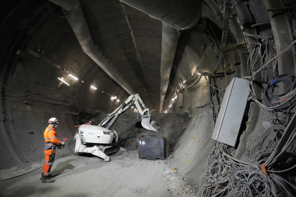 Technicians work in a tunnel for radioactive waste in an underground laboratory run by French radioactive waste management agency Andra, in Bure, eastern France, Thursday, Oct. 28, 2021. Nuclear power is a central sticking point as negotiators plot out the world’s future energy strategy at the climate talks in Glasgow, Scotland. (AP Photo/Francois Mori)