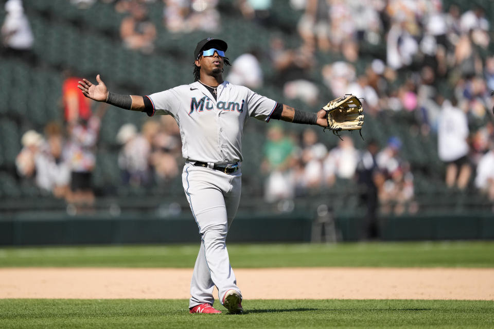 Miami Marlins' Jean Segura begins to celebrate the team's 5-1 win over the Chicago White Sox after a baseball game Saturday, June 10, 2023, in Chicago. (AP Photo/Charles Rex Arbogast)