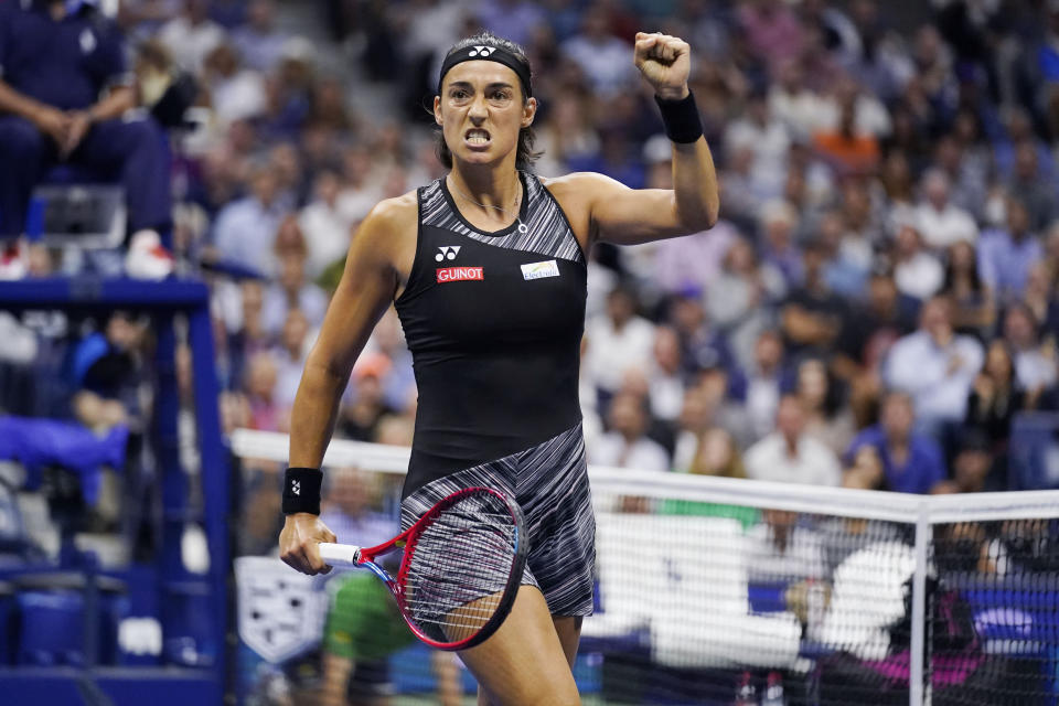 Caroline Garcia, of France, celebrates after winning a point against Coco Gauff, of the United States, during the quarterfinals of the U.S. Open tennis championships, Tuesday, Sept. 6, 2022, in New York. (AP Photo/Charles Krupa)