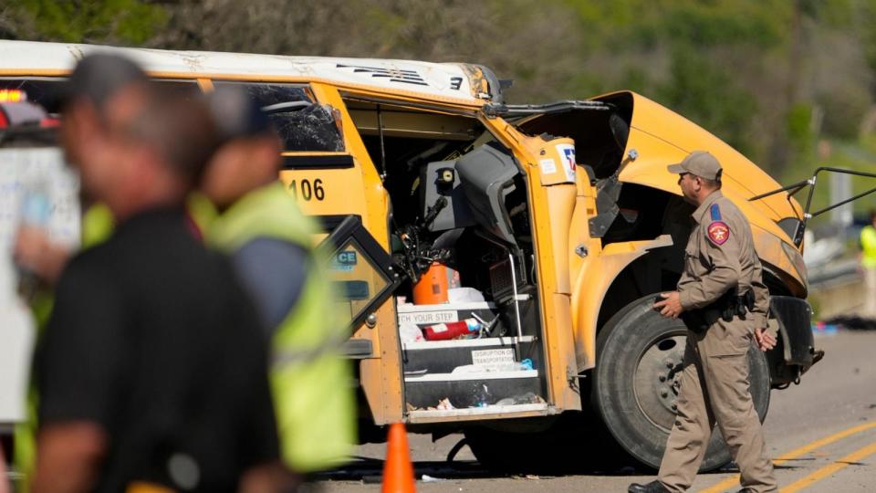 PHOTO: A DPS trooper looks at a school bus crash in Bastrop County, Texas, March 22, 2024. (Jay Janner/American-Statesman/USA TODAY Network)