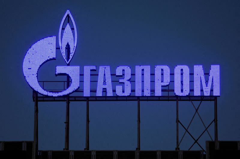 FILE PHOTO: FILE PHOTO: A Gazprom sign is seen on the facade of a business centre in Saint Petersburg