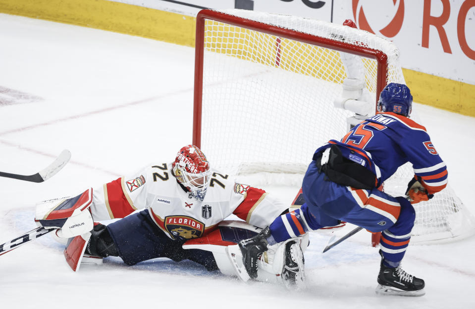 Florida Panthers goalie Sergei Bobrovsky (72) is scored on by Edmonton Oilers' Dylan Holloway (55) during the first period of Game 4 of the NHL hockey Stanley Cup Final, Saturday, June 15, 2024, in Edmonton, Alberta. (Jeff McIntosh/The Canadian Press via AP)