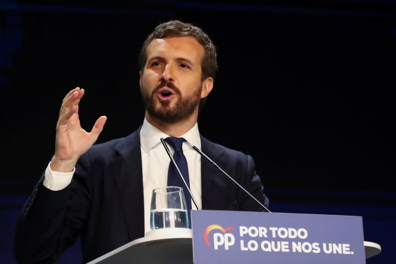 FILE PHOTO: Spain's People's Party (PP) leader Pablo Casado attends a campaign closing rally ahead of general election, in Madrid