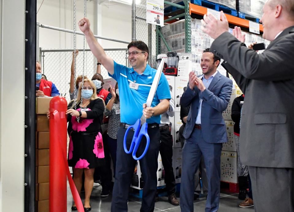 Mike Sinanian, Costco general manager, cuts the ribbon. The Melbourne Viera Costco warehouse at 4305 Pineda Causeway opened to members on December 9 at  7:30am, following a ribbon cutting ceremony. The line went around the corner of the building, with the first in line arriving Wednesday night.