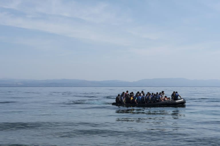 Refugees from Afghanistan arrive in a boat on the shores of Lesbos near Skala Skamnias, Greece on June 2, 2015