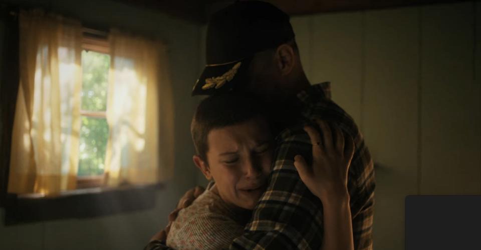 Eleven hugging Hopper in "Stranger Things"