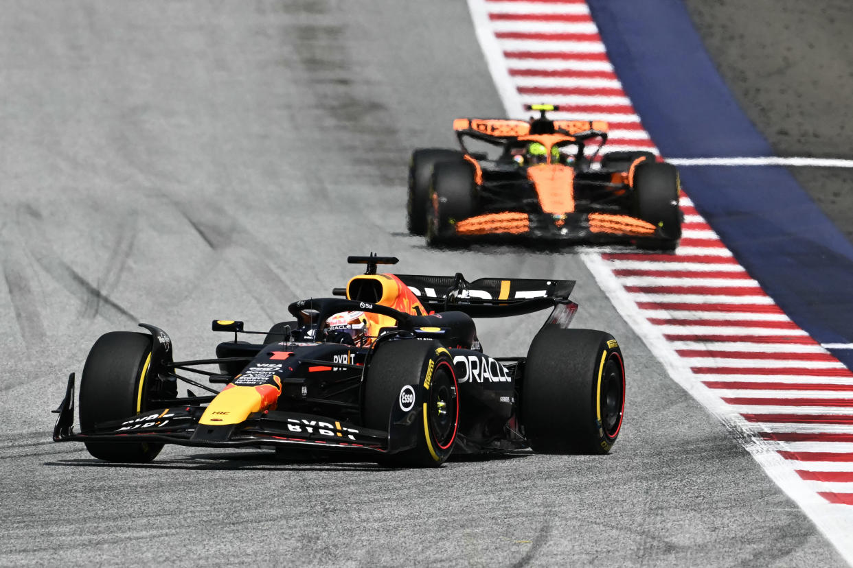 TOPSHOT - Red Bull Racing's Dutch driver Max Verstappen (front) drives ahead of McLaren's British driver Lando Norris during the Formula One Austrian Grand Prix on the Red Bull Ring race track in Spielberg, Austria, on June 30, 2024. (Photo by Joe Klamar / AFP) (Photo by JOE KLAMAR/AFP via Getty Images)