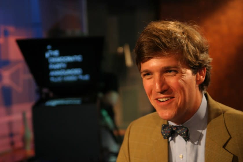 Tucker Carlson, seen here in 2004, is getting the 7 p.m. ET time slot on Fox News.