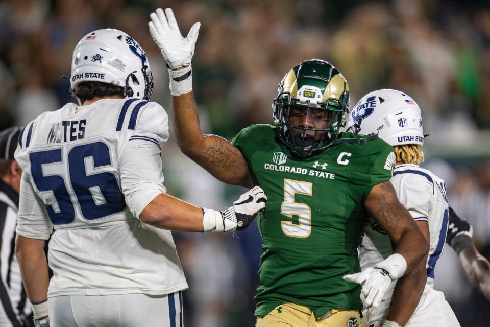 Colorado State Rams linebacker Dequan Jackson motions for a turnover against Utah State Aggies during the Rams' game at Canvas Stadium in Fort Collins, Colo. on Saturday, Oct. 15, 2022.