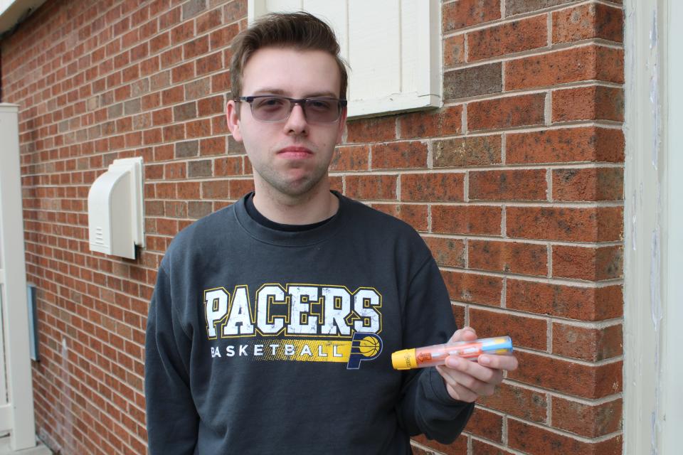 Ball State University junior Haines Hoag holds his EpiPen on April 17, 2023, in Muncie, Indiana. Hoag said he first bought an EpiPen in June 2022 after he was stung by a group of hornets.