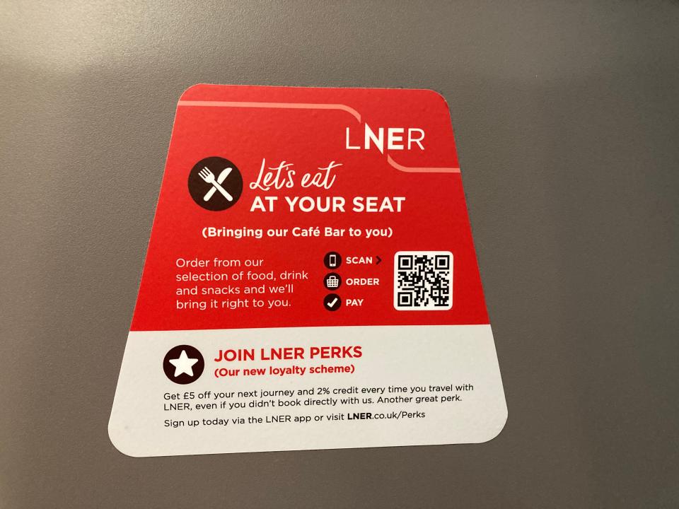 A QR code sticker on an LNER train.