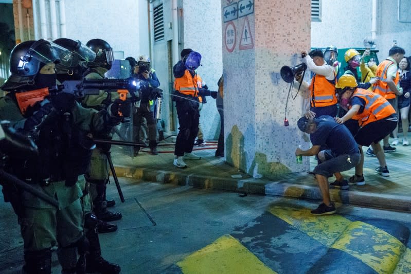 Police pepper-spray locals and neighbourhood observers after they entered a housing estate in Tseung Kwan O in Hong Kong