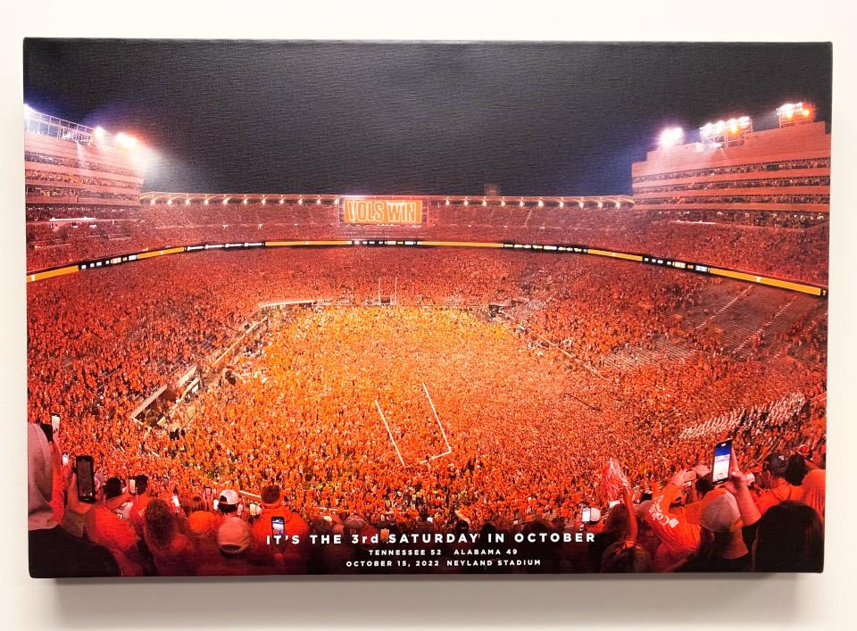 A canvas print of a photo documenting when fans stormed the field after Tennessee defeated Alabama. It's sold in stores at the Vol Shop.