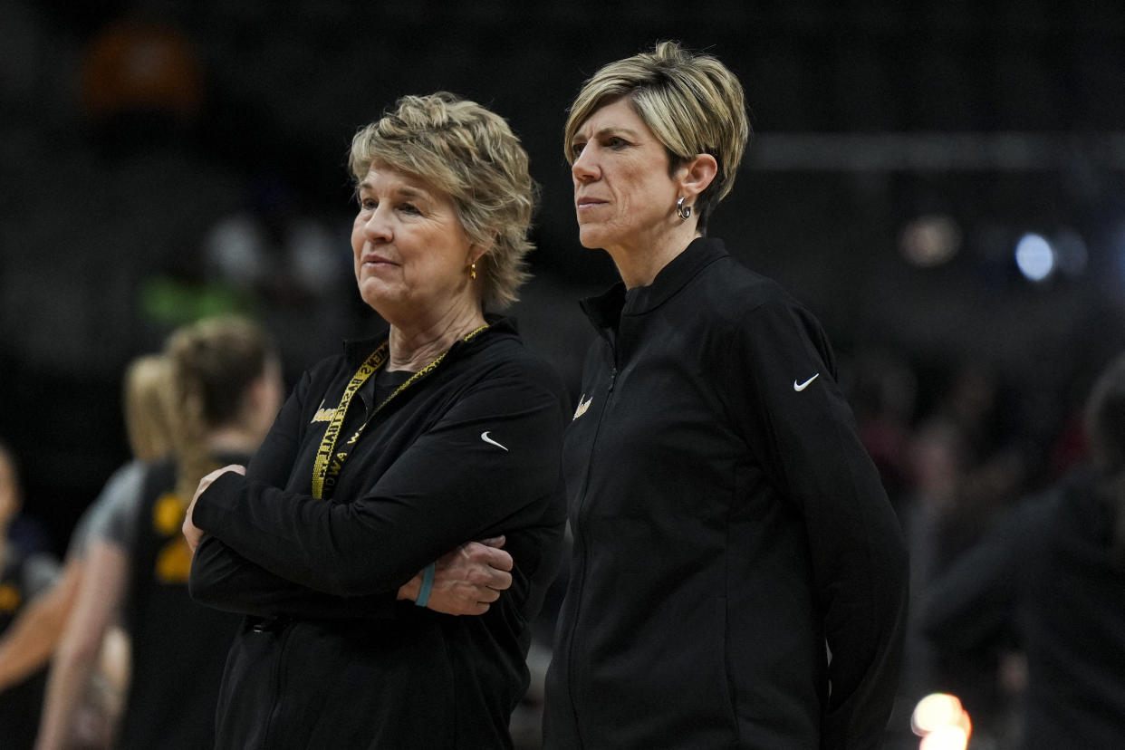 Iowa head coach Lisa Bluder, left, stands on the court with associate head coach Jan Jensen during team practice at American Airlines Center in Dallas on March 30, 2023. (Kirby Lee/USA TODAY Sports)