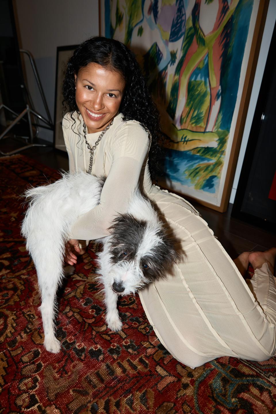 Miro wears a Sami Miro vintage asymmetric short sleeve maxi dress and shrug in ivory mesh with a Numbering Official necklace.