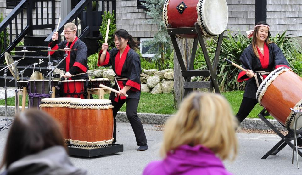 Folks watch the Kaiko drumming during the Japanese Friendship Festival at the Whitfield-Manjiro house in Fairhaven. 

[DAVID W. OLIVEIRA/STANDARD-TIMES SPECIAL/SCMG]