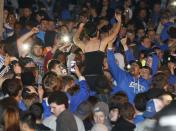 University of Kentucky fans and students take to the streets after the University of Connecticut defeated Kentucky in the NCAA Men's National Basketball Championship near the university campus in Lexington, Kentucky, April 7, 2014. REUTERS/ John Sommers II (UNITED STATES - Tags: CIVIL UNREST SPORT BASKETBALL)