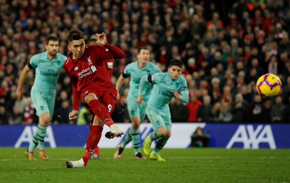 Soccer Football - Premier League - Liverpool v Arsenal - Anfield, Liverpool, Britain - December 29, 2018  Liverpool's Roberto Firmino scores their fifth goal from the penalty spot to complete his hat-trick   REUTERS/Phil Noble   EDITORIAL USE ONLY. No use with unauthorized audio, video, data, fixture lists, club/league logos or "live" services. Online in-match use limited to 75 images, no video emulation. No use in betting, games or single club/league/player publications.  Please contact your account representative for further details.