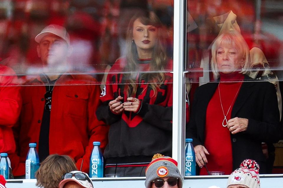 Taylor Swift in a stand at a football game.