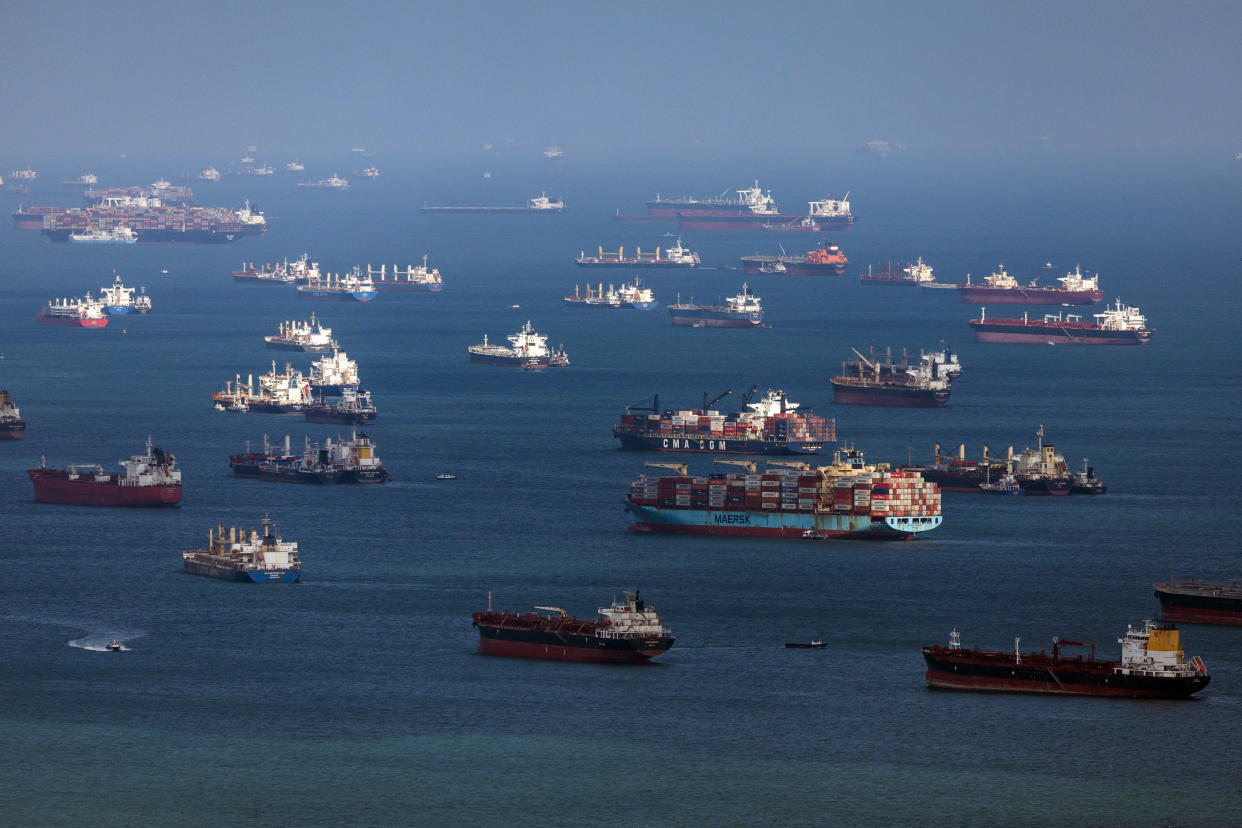FILE PHOTO: Container ships and bulk carriers offshore from Singapore, on Monday, Feb. 19, 2024. (Photo: SeongJoon Cho/Bloomberg)