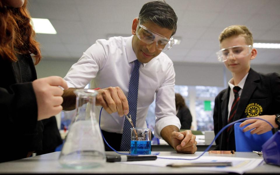 Rishi Sunak visits a chemistry class at Erasmus Darwin Academy in Burntwood, central England today - Andrew Fox/AFP