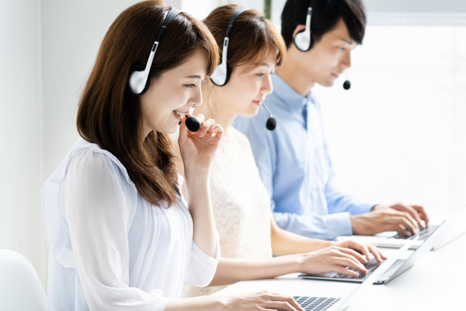 young asian operator working in office