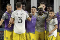 Columbus Crew forward Gyasi Zerdes (11), third from right, is congratulated by teammates after scoring during the second half of a MLS soccer match against the New England Revolution, Saturday, Sept. 18, 2021, in Foxborough, Mass. (AP Photo/Mary Schwalm)