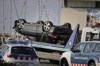<p>An overturned car is transported on a platform from the spot where terrorists were intercepted by police in Cambrils, Spain, Friday, Aug. 18, 2017. (Photo: Emilio Morenatti/AP) </p>
