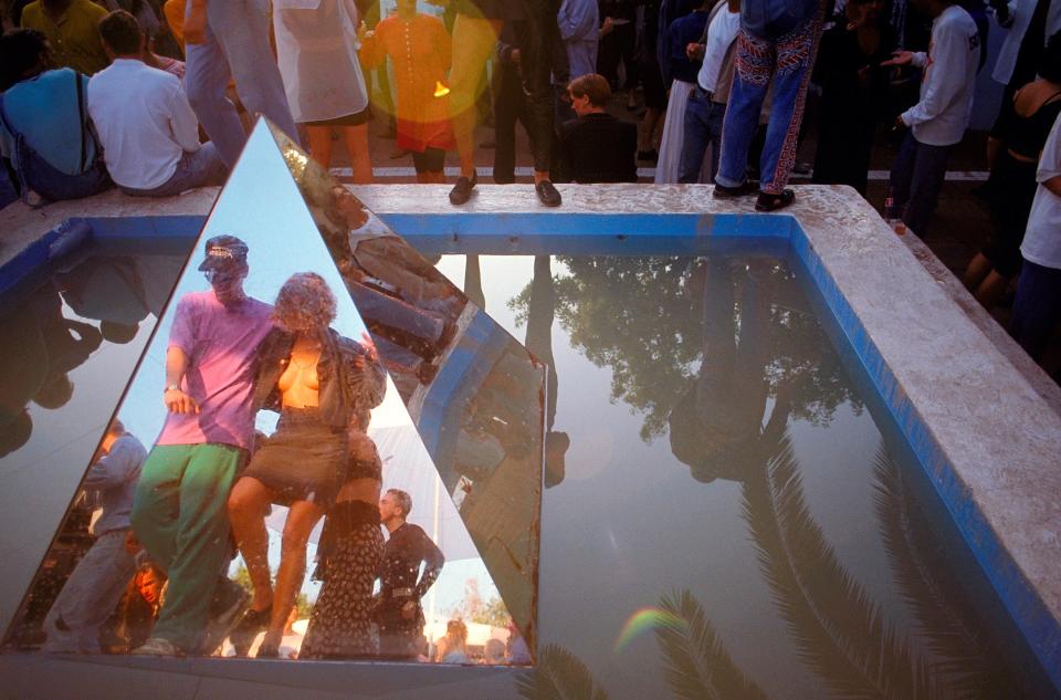 <p>A couple dancing in the morning sunshine reflected in the mirrored pyramid at Amnesia</p>Dave Swindells