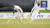 West Indies bowler Roston Chase reacts as Sri Lankan captain Dimuth Karunaratne is run out during the day three of their second test cricket match in Galle, Sri Lanka, Wednesday, Dec. 1, 2021. (AP Photo/Eranga Jayawardena)