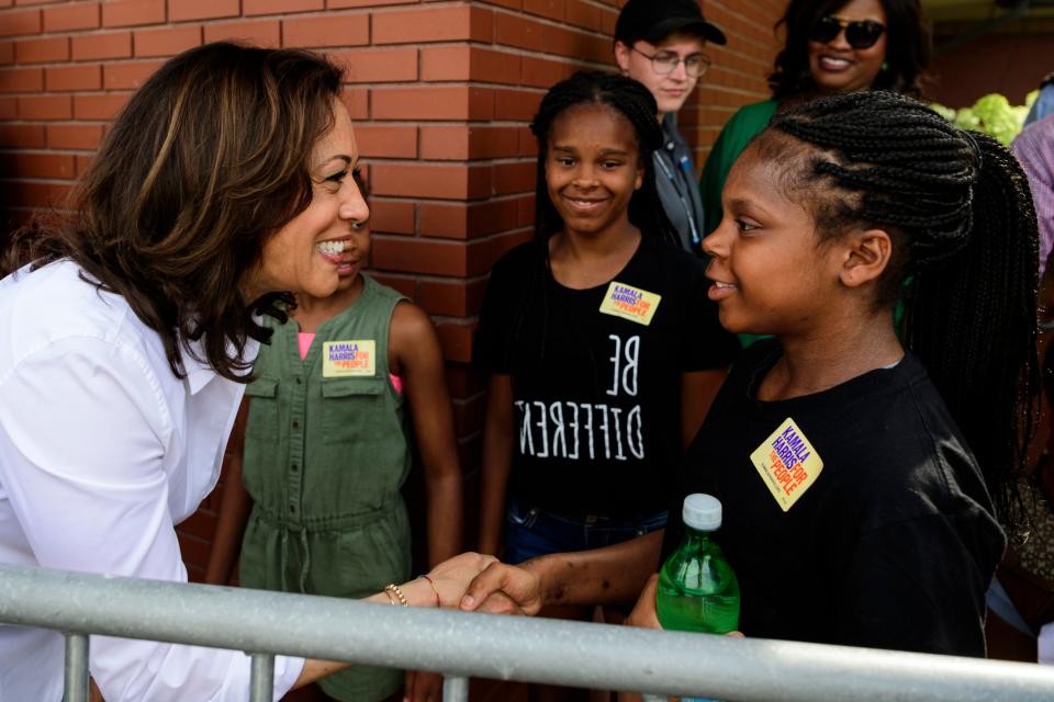 Before giving her Des Moines Register Political Soapbox stump speech, U.S. Sen. Kamala Harris, D-Cali., left, meets 15-year-old Jayla Poindexter, right, and her sisters 11-year-old Carsyn, center left, and 15-year-old Brya, center right, at the Iowa State Fair in Des Moines, Iowa, Saturday, Aug. 10, 2019. The sisters traveled with their mother Carla Poindexter from their home in Plainfield, Ill., to meet Harris and see her speak. 