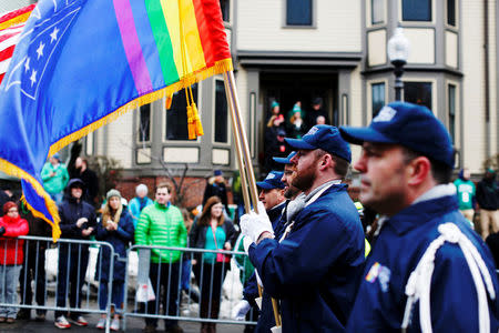 FILE PHOTO - The color guard for LGBT veterans group OutVets marches down Broadway during the St. Patrick's Day Parade in South Boston, Massachusetts, U.S. on March 15, 2015. REUTERS/Dominick Reuter/File Photo