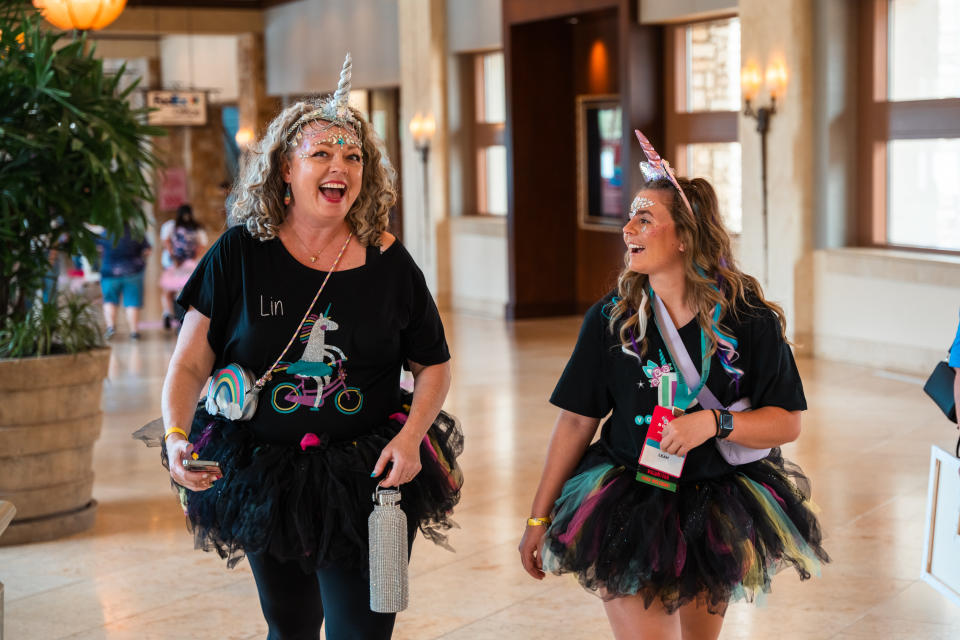Hoover's sister Lin Reynolds (left) started a tradition for Book Bonanza volunteers: many of them dress like unicorns.<span class="copyright">Courtesy of Lauren Black/Book Bonanza</span>