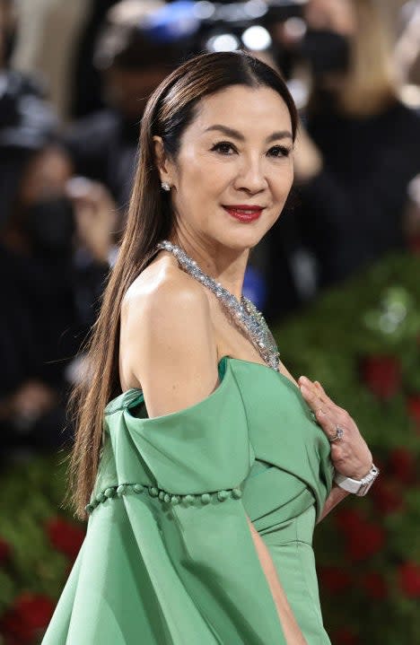 A closeup of Michelle Yeoh from the waist up