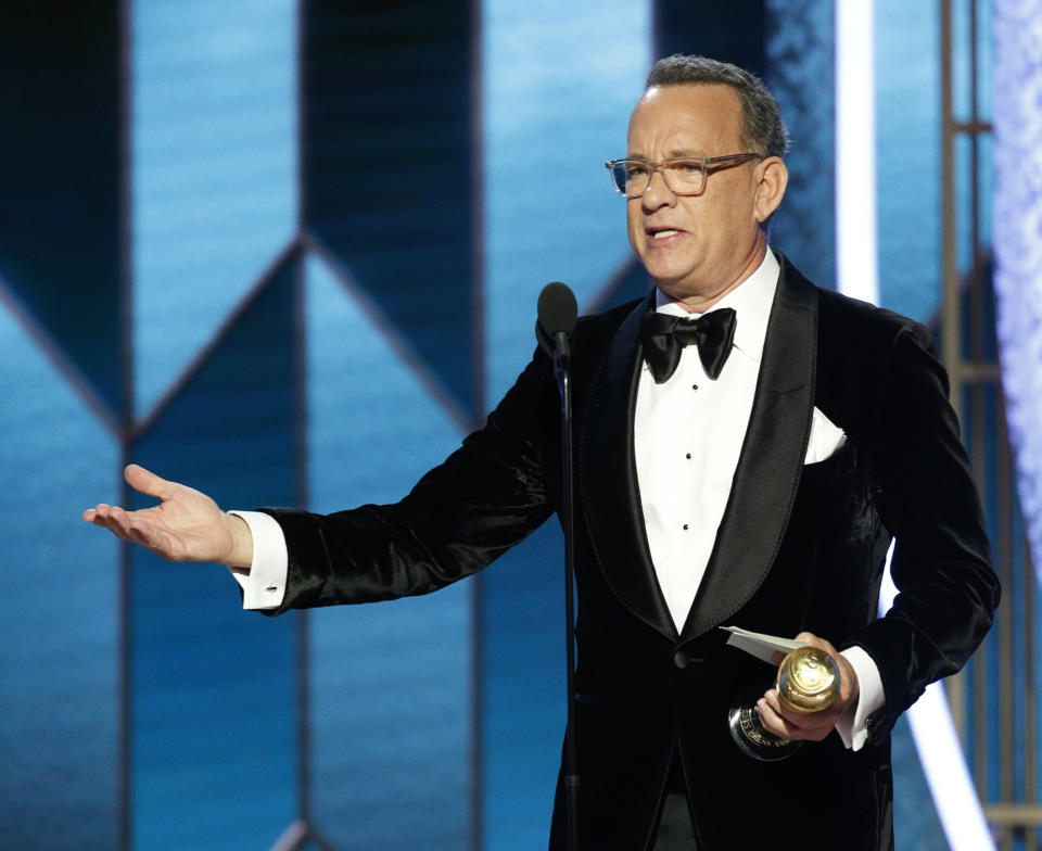 This image released by NBC shows Tom Hanks accepting the Cecil B. DeMille Award at the 77th Annual Golden Globe Awards at the Beverly Hilton Hotel in Beverly Hills, Calif., on Sunday, Jan. 5, 2020. (Paul Drinkwater/NBC via AP)