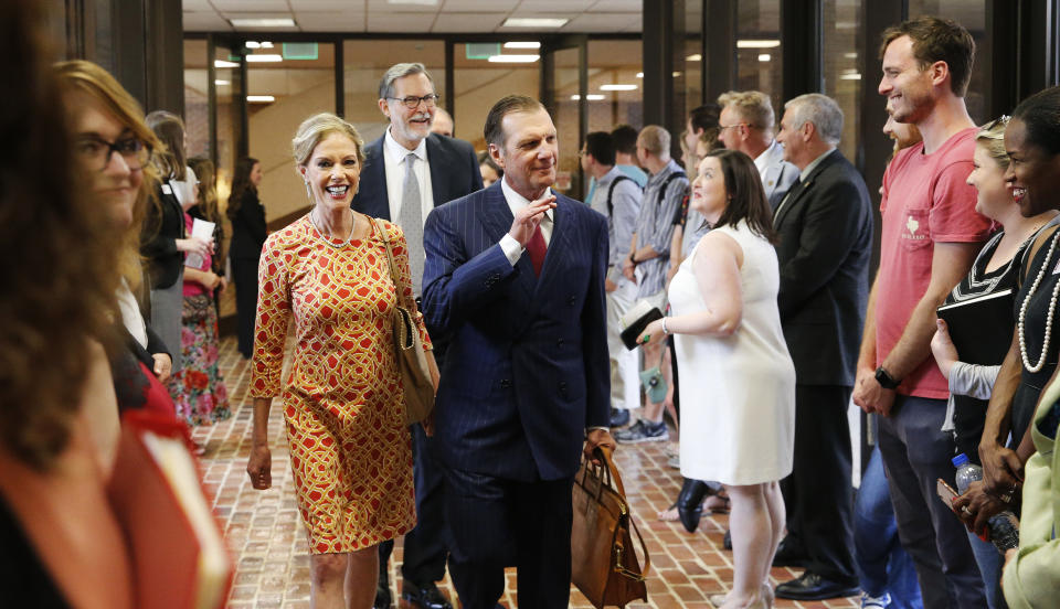 In this Sept. 20, 2018, photo, Hugh F. Culverhouse Jr. and his wife, Eliza, enter the University of Alabama law school in Tuscaloosa, Ala. The university appears poised to reject a $26.5 million pledge by Culverhouse, who recently called on students to boycott the university over the state’s new abortion ban. (Gary Cosby Jr./The Tuscaloosa News via AP)